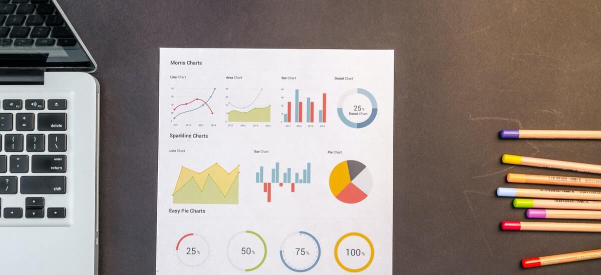 charts-on-black-wooden-table.jpg